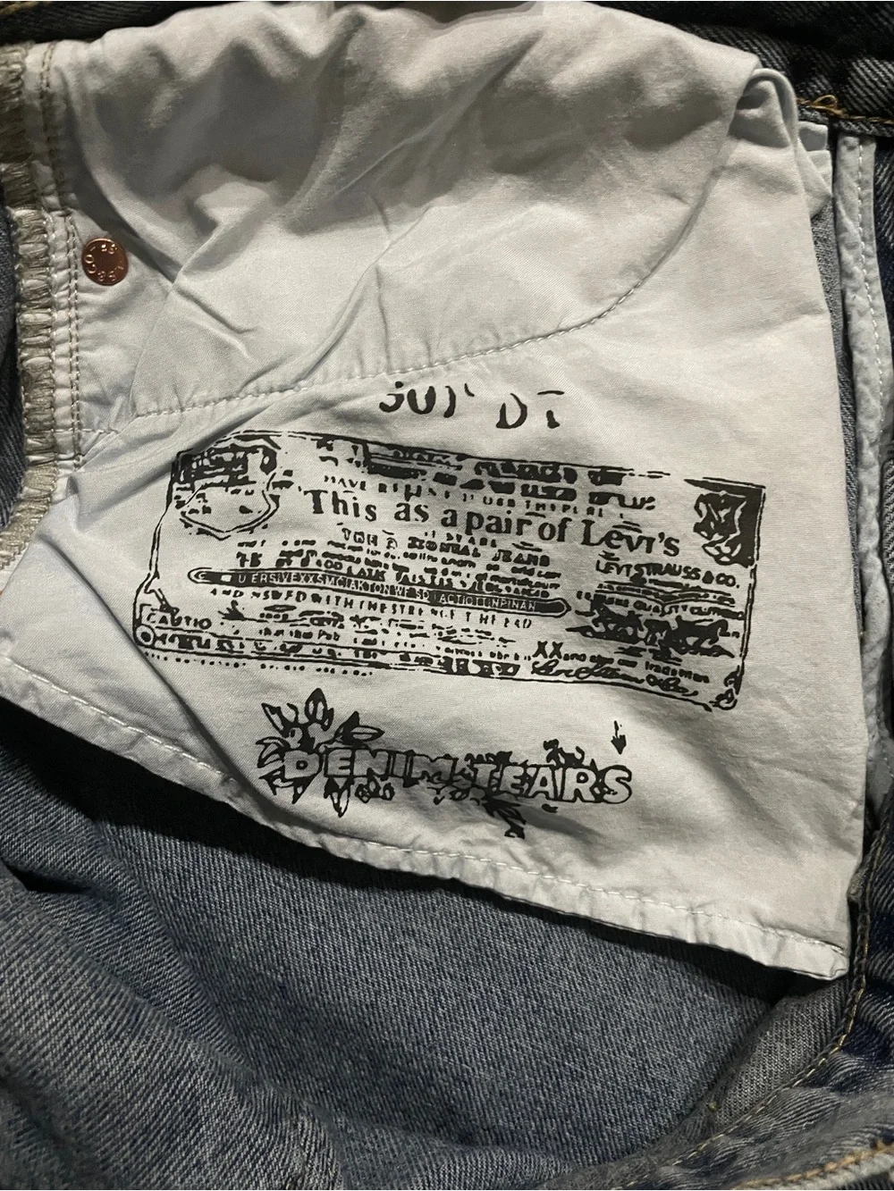 Relaxed Light Blue Jeans with White Graphic Clusters